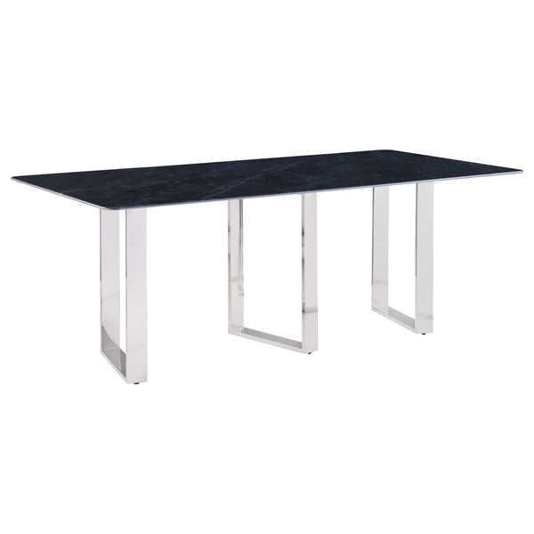 Inject a sense of sophistication with a modern rectangular dining table. Featuring a sintered stone tabletop with a gray marble finish and slim, sleek silhouette, the table becomes a stylish centerpiece in your dining room. It stands on three open frame l