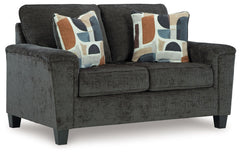 Thereâ€™s something about this loveseat thatâ€™s so easy to appreciate. Maybe itâ€™s the plush upholstery and soothing tone, eager to support your quest for total relaxation. Perhaps it-'s the modern flair of its simple lines, tapered legs and abstract-pa