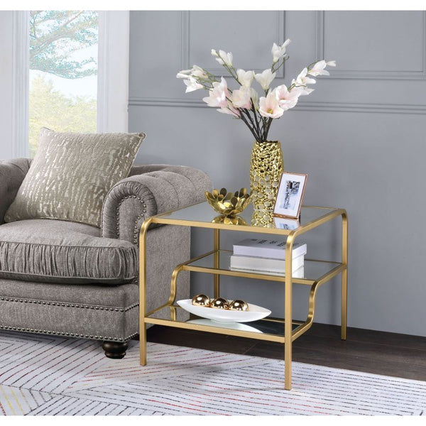 Center your seating arrangement around a sleek and sophisticated style with the Astrid occasional collection. Inspired by timeless materials, it features a mirror top with a stylish curving frame made of refined gold metal coating. An open base and floati
