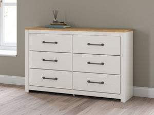  while framed drawer fronts with pewter-tone handles enhance its charming appeal. Looking for furniture that offers storage and a peaceful escape 