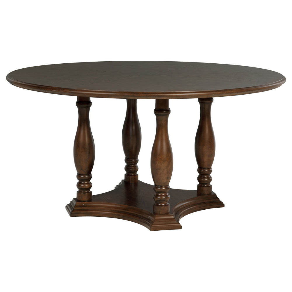 Upgrade your kitchen or dining room with the classic design of a round wood dining table. Crafted with oak veneer in a rich brown finish, it imparts elegance with subtle trim details and its depth of color. The table boasts a decorative base design with a