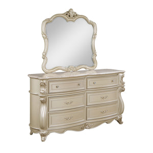 The Monique Marble Top 6 Drawer Dresser in Champagne combines heirloom quality construction with timeless French Provincial elegance. Crafted with poplar solids and birch veneers, this dresser is built for strength and durability. Its design reflects the 