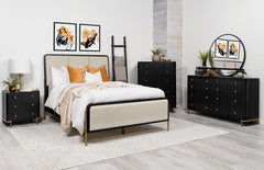 This coastal-inspired bedroom set blends mid-century modern influences with natural textures for a serene retreat. The bed features a cream fabric upholstered headboard and footboard, framed by a wire-brushed wood finish that enhances the beauty of rubber