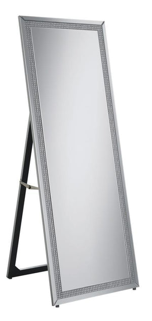 This standing mirror offers a polished balance of function and glamour, framed in sleek mirrored panels with an inset of faceted acrylic crystal inlay. Designed for full-length reflection, its clean rectangular silhouette is supported by an easel back for