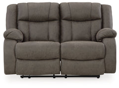 This loveseat tees you up to catch up on streaming or enjoy the latest game without breaking the bank. Its easy reclining motion and inviting stitched details craft a stylish seat that keeps you utterly at ease. And with a versatile neutral faux leather, 