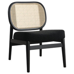 This accent chairs introduces a warm, airy presence to any living area. Lounge chair features a rattan open cane webbing back that breathes natural style and a fabric upholstered cushioned seat for soft, supportive comfort. The solid hardwood frame provid