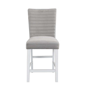  the Elizaveta counter height dining table will fulfill all your dining needs. The white high gloss finish blends in perfectly with the glimmering faux diamond inlay base. The tabletop features silver a