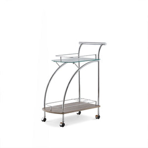 Featuring a retro inspired design, the Badin serving cart has a floating top glass shelf for immediate access and a lower gallery shelf to keep your additional items safe from falling out. Finished in chrome and rolling on four plastic casters, this cart 