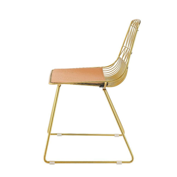  this piece will make a classy companion to any table. With its whiskey faux leather and gold finish