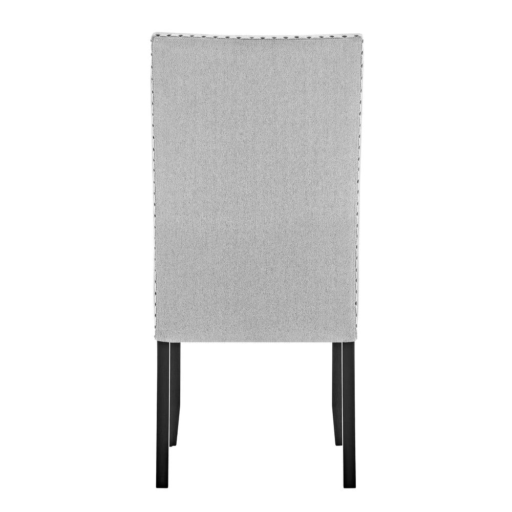 A fresh take on a traditional silhouette makes this group a great addition to your dining space. A genuine marble top is luxurious and timeless. The trestle base is updated in a contemporary charcoal finish. The upholstered dining chairs feature nail head