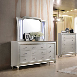 The Kaitlyn mirror provides a commanding presence in any room. Crafted with a transitional look that is an ideal addition to any bedroom, the mirror is accented with LED light and a crystal-like sparkling trim. Its crystal-like trimming creates dazzling g
