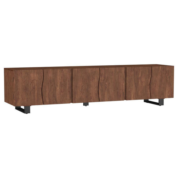 This spacious TV stand is crafted from solid mango wood, offering ample storage with its four doors and adjustable shelves. The mango brown finish highlights the natural beauty of the wood grain, giving it a warm and timeless look. Curved panel details on