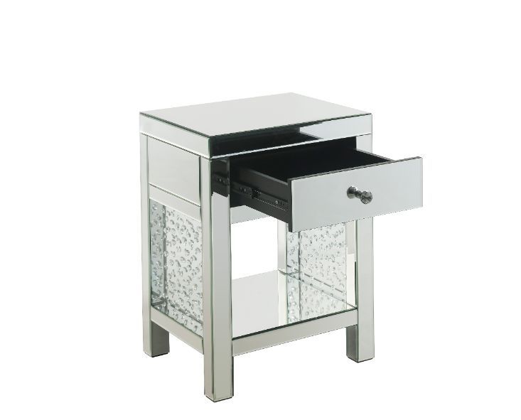 The Nysa Accent Table will give any room a touch of glamour. Mirrored finish and glass surfaces give it a modern and clear touch while faux crystals inlays add glam style to this piece. Use this unique piece as the perfect accent for any room dÃ©cor. It h