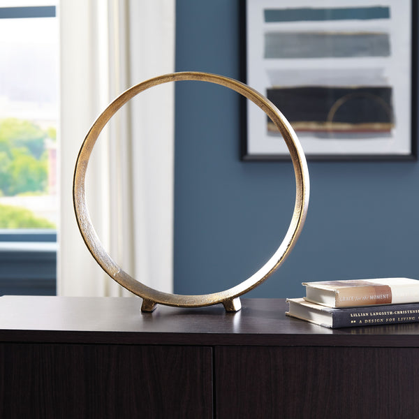  this sculpture rounds out your decor in sleek style. The antiqued brass-tone finish has a rustically luxe look that remains versatile