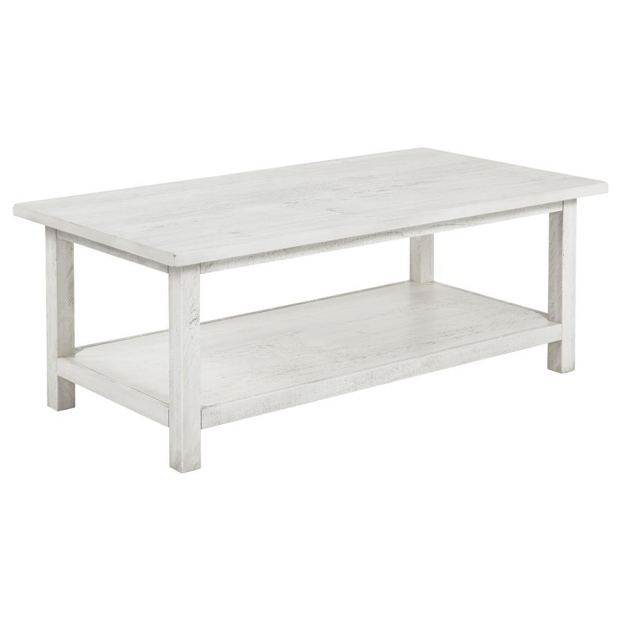 Bring timeless appeal and ample surface space to your living area with this rectangular coffee table. A pine wood and engineered wood construction, enhanced by pine veneer, ensures durability while exuding a warm rustic charm. Its open lower shelf keeps d
