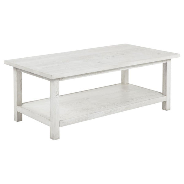 Bring timeless appeal and ample surface space to your living area with this rectangular coffee table. A pine wood and engineered wood construction, enhanced by pine veneer, ensures durability while exuding a warm rustic charm. Its open lower shelf keeps d