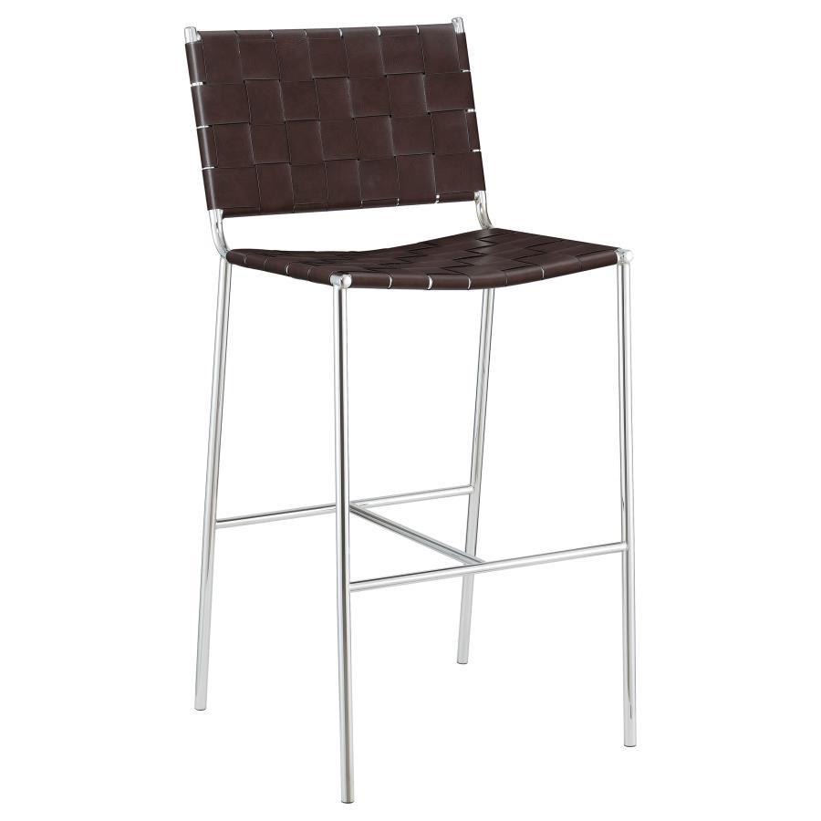 Mid-century elements lead the design aesthetic of this contemporary stool. A slim metal frame in a gleaming chrome finish offers a striking contrast against the brown faux leather accents. Narrow leatherette bands weave together to create a backrest and s