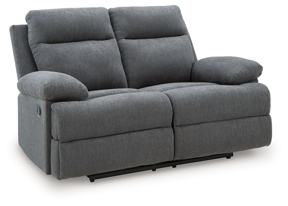 Fully upright or completely stretched out, this traditional-inspired reclining loveseat caters to the art of relaxation. Super soft charcoal-colored upholstery and sumptuous cushioningâ€”made all the more indulgent with pillow top armsâ€”cradles you in co