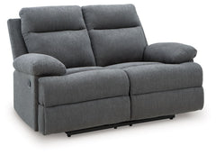 Fully upright or completely stretched out, this traditional-inspired reclining loveseat caters to the art of relaxation. Super soft charcoal-colored upholstery and sumptuous cushioningâ€”made all the more indulgent with pillow top armsâ€”cradles you in co