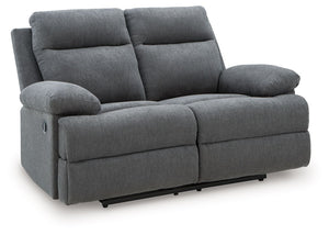 Fully upright or completely stretched out, this traditional-inspired reclining loveseat caters to the art of relaxation. Super soft charcoal-colored upholstery and sumptuous cushioningâ€”made all the more indulgent with pillow top armsâ€”cradles you in co
