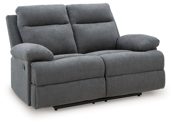 Fully upright or completely stretched out, this traditional-inspired reclining loveseat caters to the art of relaxation. Super soft charcoal-colored upholstery and sumptuous cushioningâ€”made all the more indulgent with pillow top armsâ€”cradles you in co