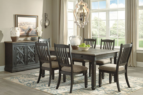 Unique two-tone finish with a combination of Oak and Acacia substrates combining a trendy textured antique black color with table and server tops finished in a textural weathered oak finish. Rectangular dining table features six convenient drawers for sto