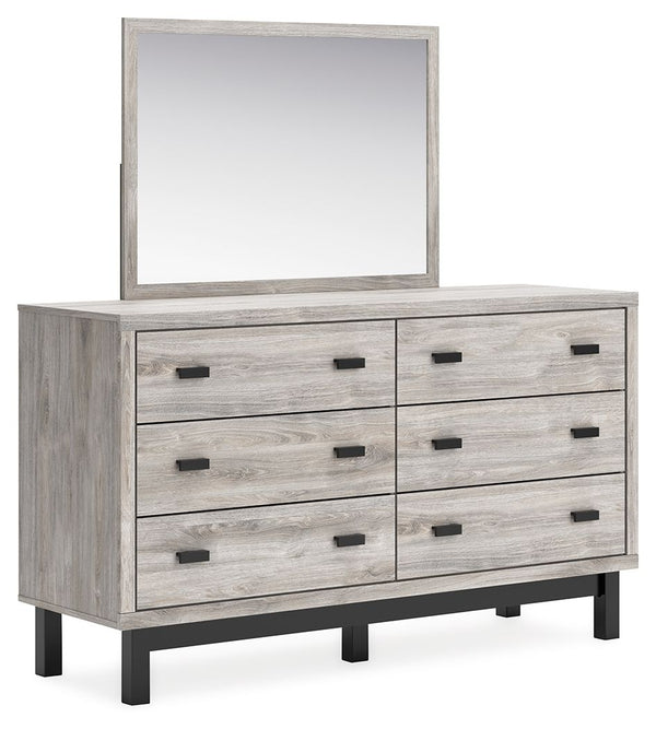 Craft a contemporary hideaway without breaking the bank. An elegant juxtaposition of refined neutral hues, this two-toned dresser with mirror brings sleek style to your space. Matte black drawer handles enhance the sheer simplicity of its profile. With th