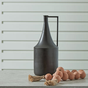  this vase is an eye-catching accent. Its angular handle provides a sharp