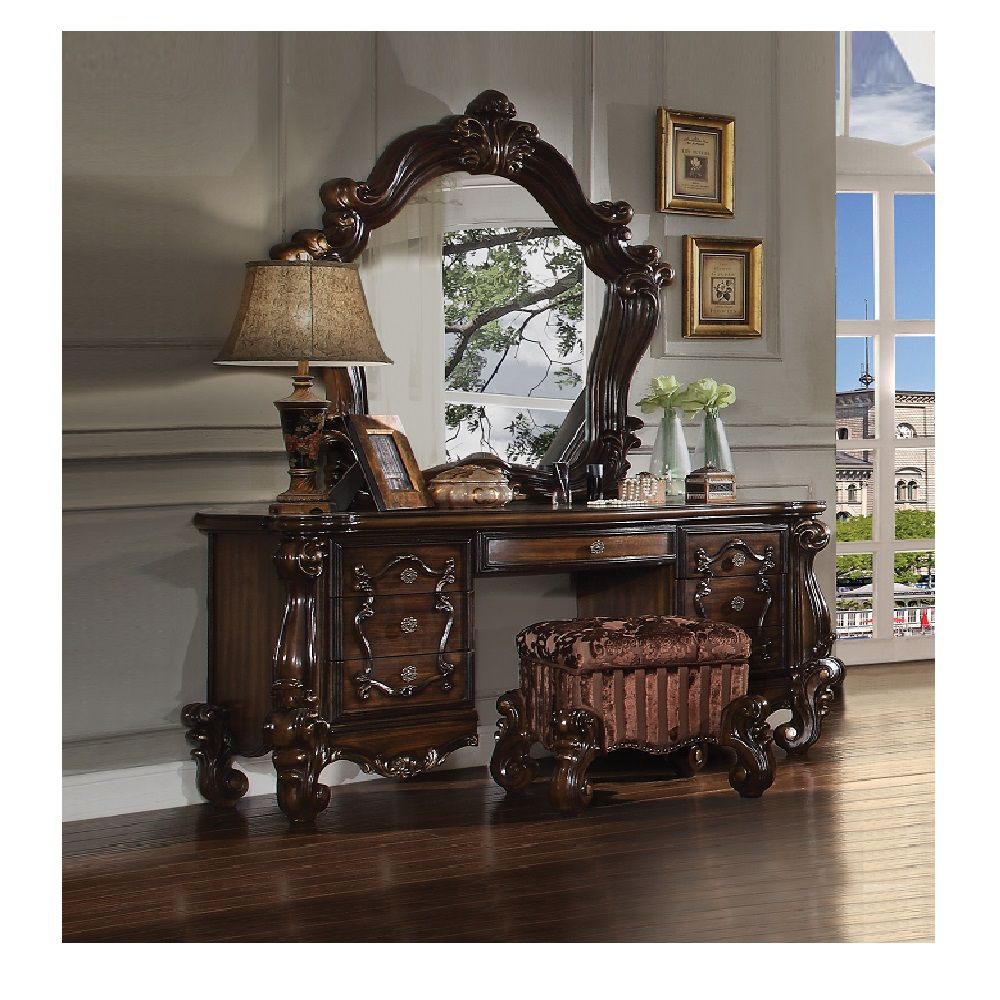 The Versailles mirror gives your bedroom all the grandeur of royal style. Presented in a stately cherry oak finish this mirror has a substantial silhouette and is adorned with such old-world details, carved medallions, and shaped moldings. This mirror is 