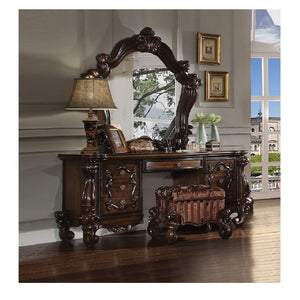 The Versailles mirror gives your bedroom all the grandeur of royal style. Presented in a stately cherry oak finish this mirror has a substantial silhouette and is adorned with such old-world details, carved medallions, and shaped moldings. This mirror is 