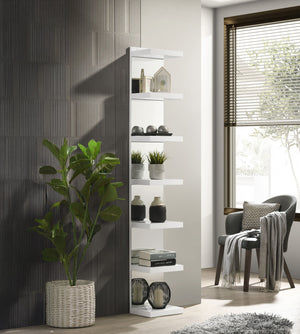 This sleek, modern shelving unit offers a perfect blend of style and functionality, making it a versatile addition to any room. With clean, minimalist lines and a crisp, white finish, it seamlessly complements contemporary decor, adding a touch of eleganc