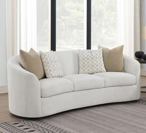  upholstered in a softly textured latte boucle upholstery throughout its elegantly designed