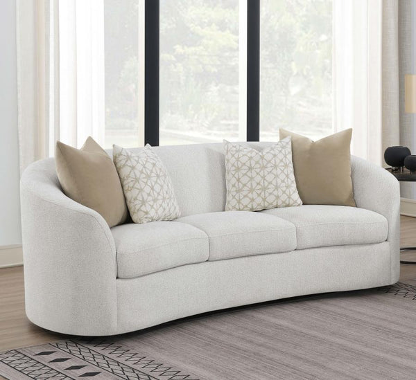  upholstered in a softly textured latte boucle upholstery throughout its elegantly designed
