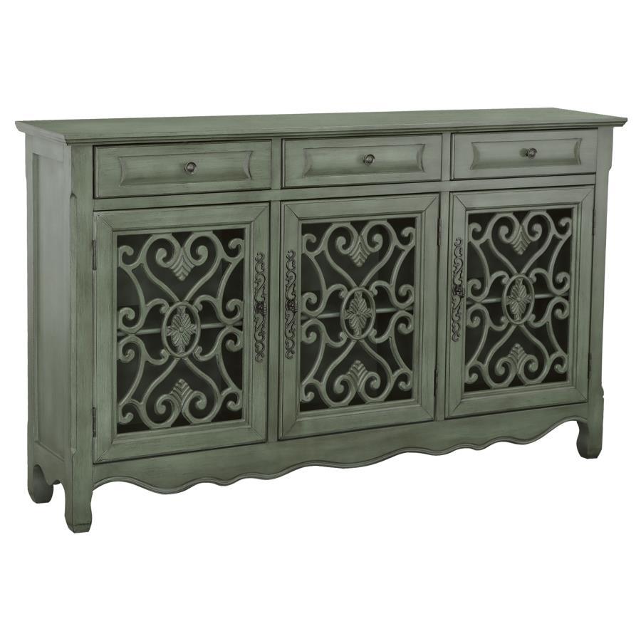 This traditional accent cabinet brings vintage elegance with a romantic twist. Finished in antiqued green, it features intricate bronze hardware, scalloped apron detailing, and sculpted feet. Three doors reveal adjustable interior shelving, while three dr