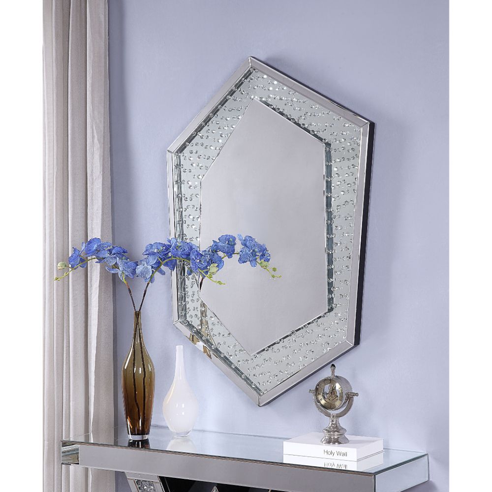 Open up space in any room with this sophisticated, eye-catching, Nysa wall mirror. Its clean-lined hexagon silhouette brings visual appeal to your decor, while its shimmering mirrored frame is perfect set against a crisp white wall for a prominent look. L