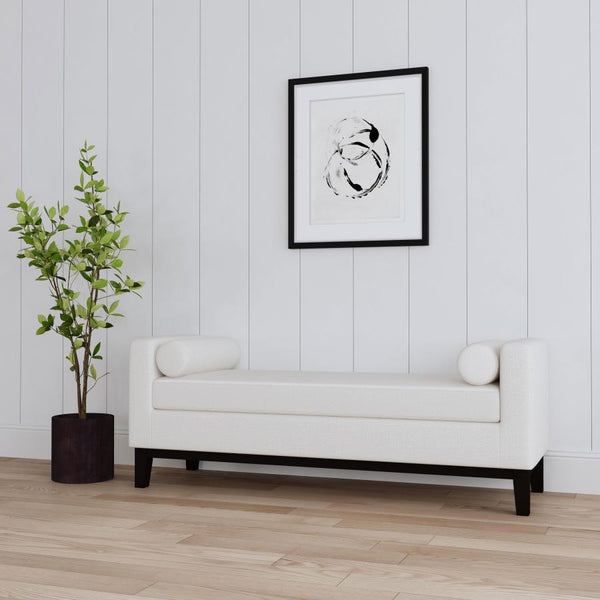  sophisticated living area or master suite with a modern upholstered bench. The backless design includes straight track arms