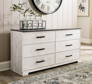  while the warm pewter-tone hardware adds an industrial touch. The dresser-'s distressed whitewashed body adds a delightfully homespun cha