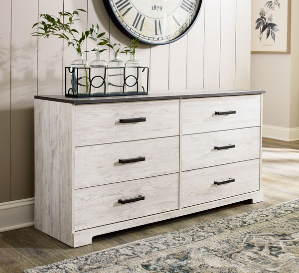  while the warm pewter-tone hardware adds an industrial touch. The dresser-'s distressed whitewashed body adds a delightfully homespun cha