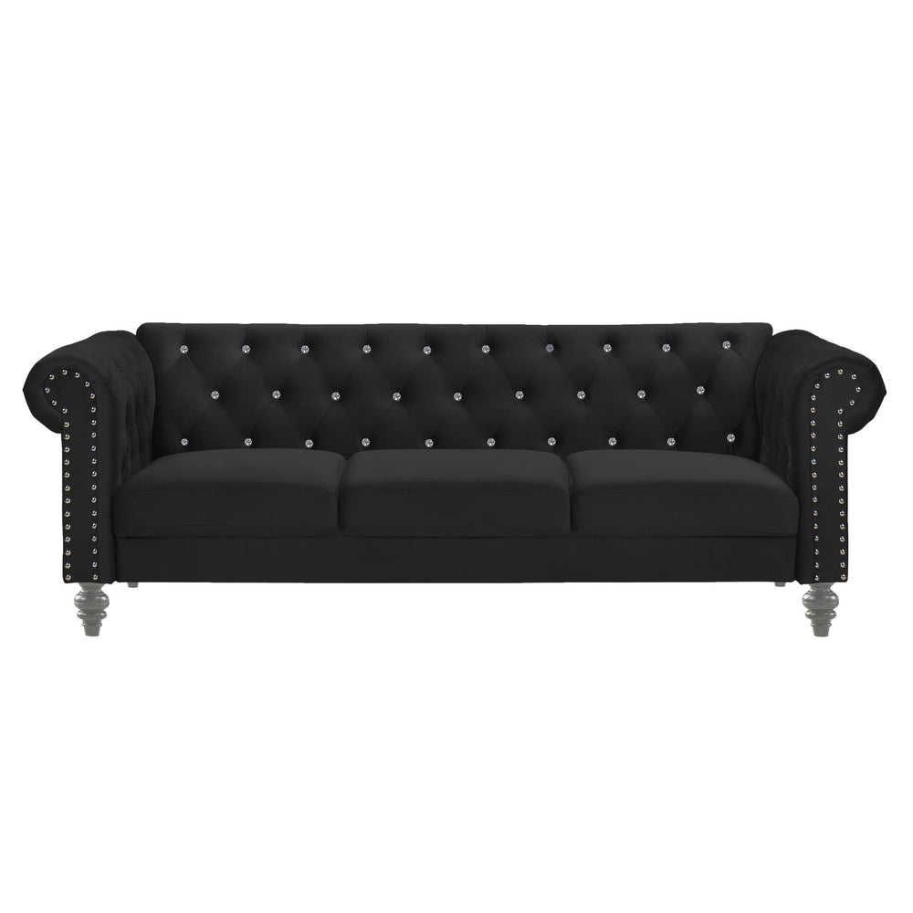 The New Classic Emma Chesterfield Velvet 3 Seat Sofa is a blend of soft elegance and sophisticated design. Crafted from 100% polyester velvet fabric, it offers cozy and indulgent seating for three. The glam tailoring features tufted backs and arms adorned