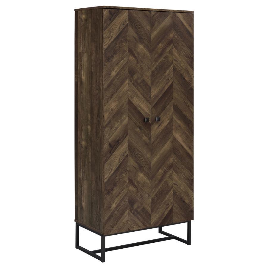 This tall storage cabinet blends rustic charm with modern utility, featuring a rustic oak finish and herringbone-patterned door fronts. Made from engineered wood with a scratch-resistant and eco-friendly laminate veneer, it includes multiple fixed shelves