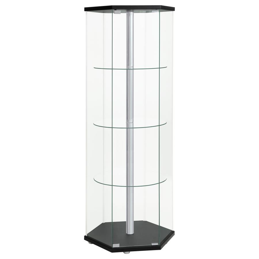 Explore the cutting edge properties of geometric design. Made from glass, this curio cabinet wakes up a contemporary space and puts a new spin on an old classic. Hexagonal in shape, it features a cool center pole for visual effect. A black finish top and 