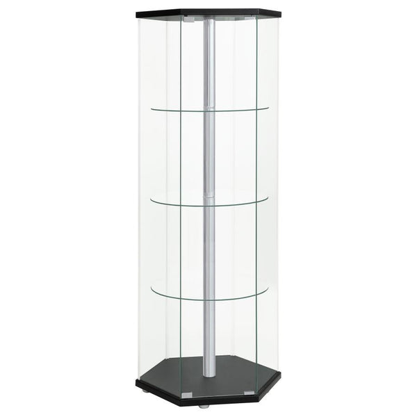 Explore the cutting edge properties of geometric design. Made from glass, this curio cabinet wakes up a contemporary space and puts a new spin on an old classic. Hexagonal in shape, it features a cool center pole for visual effect. A black finish top and 
