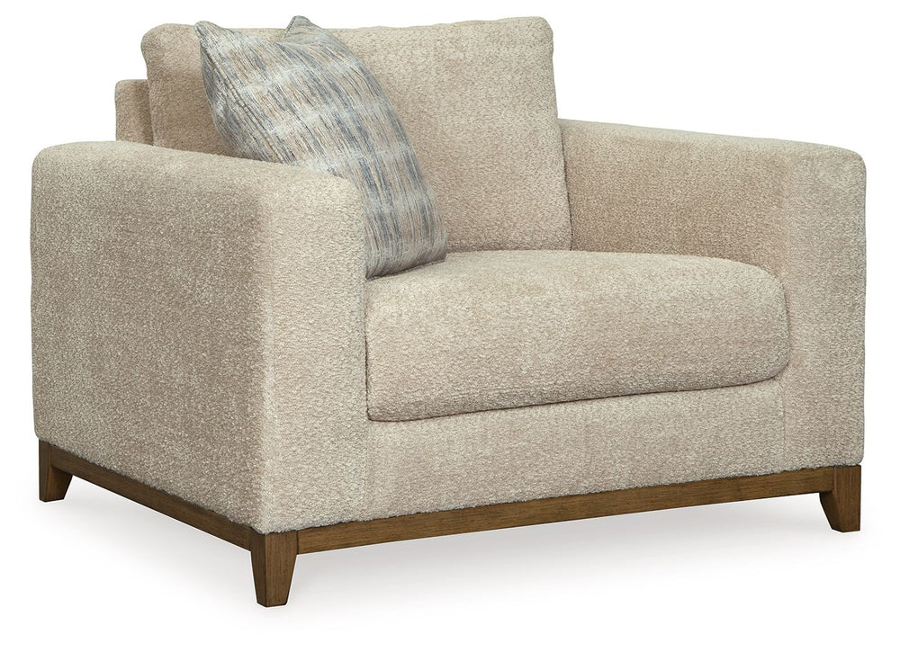 Serene style with a modern sensibility. Delight in the cozy, versatile embrace of this oversized chair. It takes an on-trend approach to irresistible texture and natural beauty, showcasing soft upholstery accented with a transitional wood trim. As refined