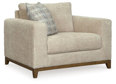 Serene style with a modern sensibility. Delight in the cozy, versatile embrace of this oversized chair. It takes an on-trend approach to irresistible texture and natural beauty, showcasing soft upholstery accented with a transitional wood trim. As refined