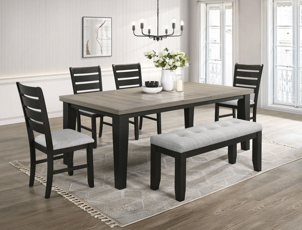 This dining group effortlessly combines farmhouse warmth with modern sophistication, creating a captivating focal point for any dining space. The table features a rich, two-tone design with a beautifully finished wood top and contrasting dark legs, delive