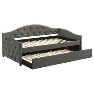 Sweeping lines and timeless details come together in this transitional twin daybed and trundle set. Wrapped in a soft fabric that coordinates with all sorts of color palettes, this daybed and trundle combo lends traditional elements such as a button-tufte
