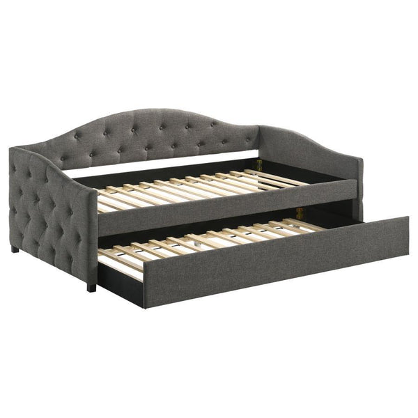 Sweeping lines and timeless details come together in this transitional twin daybed and trundle set. Wrapped in a soft fabric that coordinates with all sorts of color palettes, this daybed and trundle combo lends traditional elements such as a button-tufte