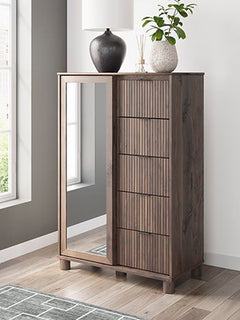 Crafted with both form and function in mind, this dressing chest brings a dash of retro-cool character to your modern boho aesthetic. Reeded accents add an on-trend touch to its classic silhouette. Warmly welcoming with a rich brown finish, the piece pair