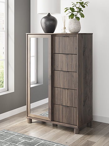 Crafted with both form and function in mind, this dressing chest brings a dash of retro-cool character to your modern boho aesthetic. Reeded accents add an on-trend touch to its classic silhouette. Warmly welcoming with a rich brown finish, the piece pair
