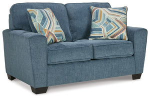 Need a simple style refresh? Liven up your living room essentials with this loveseat. A chunky silhouette holds invitingly ample cushioning you-'ll long to lounge in. Crosshatched upholstery and accent pillows give the otherwise casual design a delightful